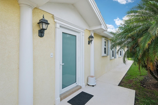 10853 SW Elsinore Dr, Port Saint Lucie, FL 34987 - property entrance with stucco siding