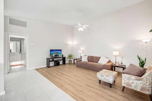 10853 SW Elsinore Dr, Port Saint Lucie, FL 34987 - living area with ceiling fan, light wood finished floors, and baseboards