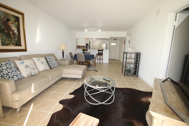 9842 Marina Blvd Unit 711, Boca Raton, FL 33428 - living room featuring tile patterned flooring and rail lighting