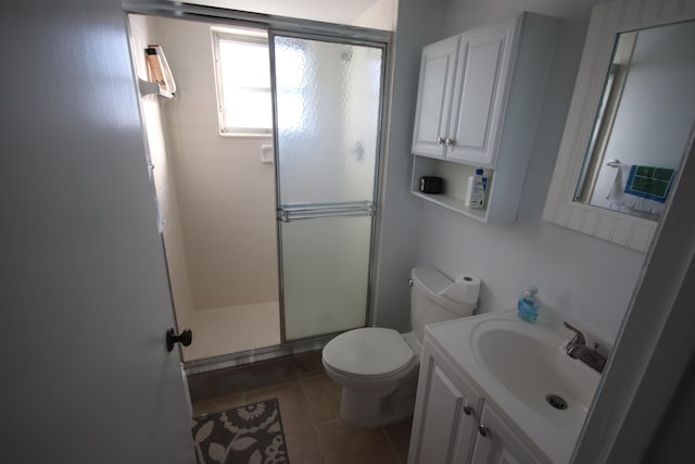9842 Marina Blvd Unit 711, Boca Raton, FL 33428 - bathroom featuring a stall shower, toilet, tile patterned floors, and vanity