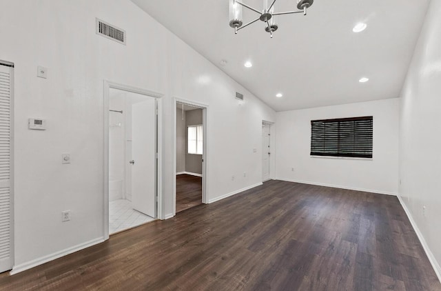 unfurnished room with a chandelier, dark wood-style flooring, baseboards, recessed lighting, and high vaulted ceiling
