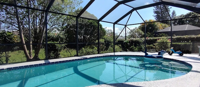 1132 SE Oriental Ave, Port Saint Lucie, FL 34952 - outdoor pool featuring glass enclosure and a patio area