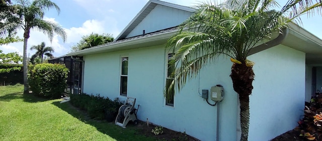 1132 SE Oriental Ave, Port Saint Lucie, FL 34952 - view of side of home with stucco siding and a yard