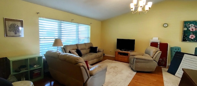 1132 SE Oriental Ave, Port Saint Lucie, FL 34952 - living area with lofted ceiling, wood finished floors, and a chandelier