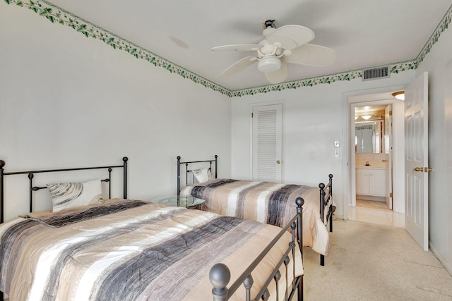 bedroom with light colored carpet, a closet, and ceiling fan