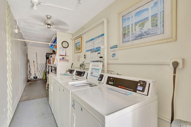 community laundry featuring washer and clothes dryer