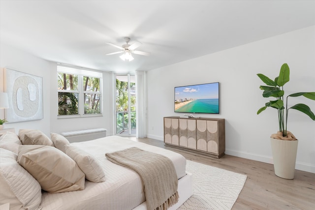 500 SE Mizner Blvd Unit A202, Boca Raton, FL 33432 - bedroom with baseboards, light wood finished floors, and ceiling fan