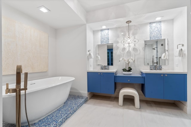500 SE Mizner Blvd Unit A202, Boca Raton, FL 33432 - full bathroom featuring vanity, a soaking tub, and baseboards