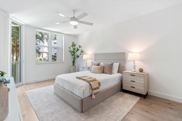 500 SE Mizner Blvd Unit A202, Boca Raton, FL 33432 - bedroom with baseboards, light wood-style floors, and a ceiling fan