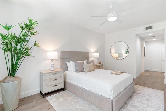 500 SE Mizner Blvd Unit A202, Boca Raton, FL 33432 - bedroom with light wood finished floors, baseboards, and a ceiling fan