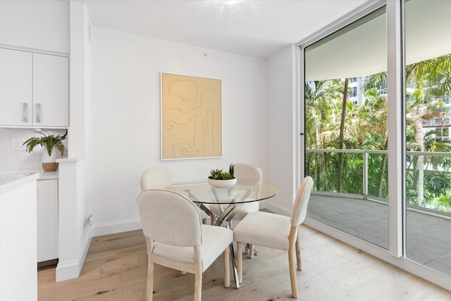 500 SE Mizner Blvd Unit A202, Boca Raton, FL 33432 - dining room with light wood-type flooring and baseboards