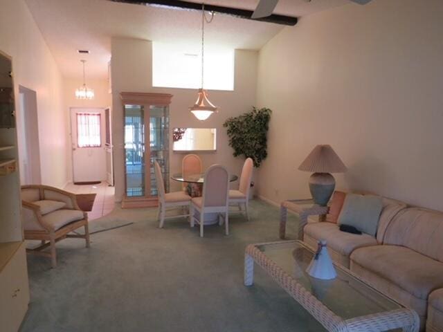 816 Sky Pine Way Unit H, Greenacres, FL 33415 - living area with carpet flooring and a chandelier