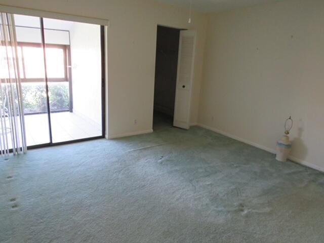 816 Sky Pine Way Unit H, Greenacres, FL 33415 - unfurnished room with carpet flooring and baseboards