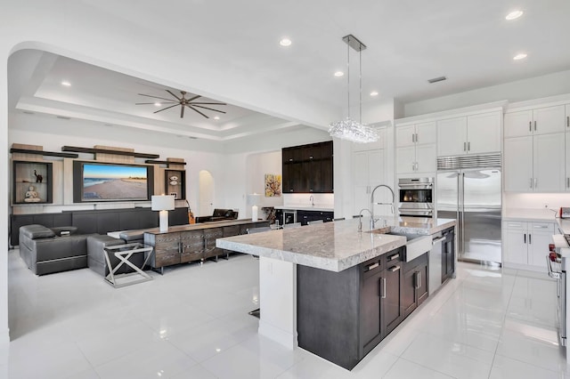 9219 Grand Prix Ln, Boynton Beach, FL 33472 - kitchen featuring appliances with stainless steel finishes, light tile patterned floors, white cabinetry, decorative light fixtures, and recessed lighting
