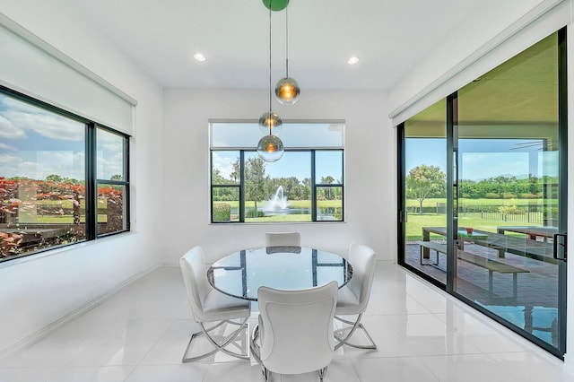 9219 Grand Prix Ln, Boynton Beach, FL 33472 - tiled dining space featuring healthy amount of natural light and recessed lighting