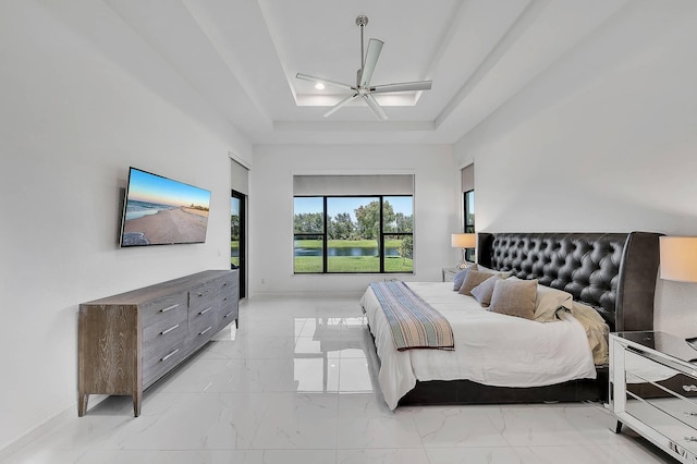 9219 Grand Prix Ln, Boynton Beach, FL 33472 - bedroom with light marble finish flooring, a raised ceiling, baseboards, and a ceiling fan