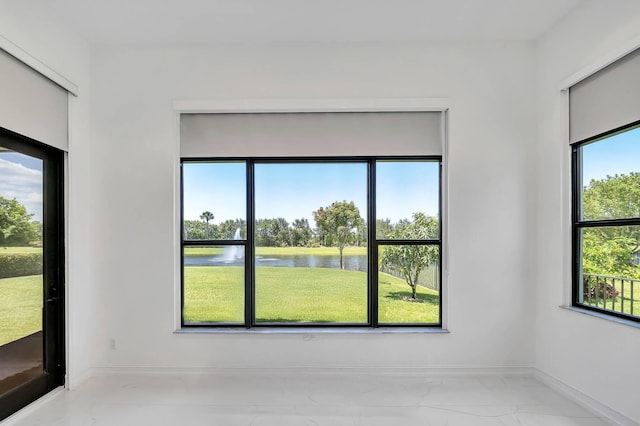 9219 Grand Prix Ln, Boynton Beach, FL 33472 - spare room with a water view and baseboards