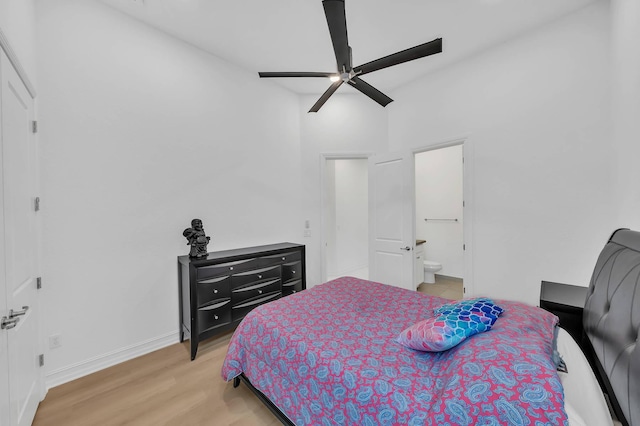 9219 Grand Prix Ln, Boynton Beach, FL 33472 - bedroom featuring light wood-type flooring, baseboards, connected bathroom, and ceiling fan