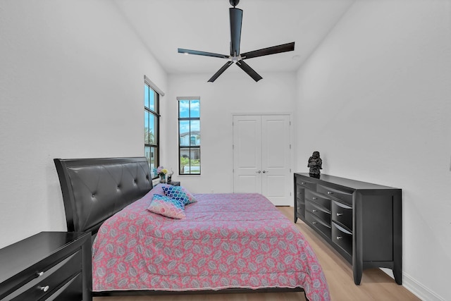 9219 Grand Prix Ln, Boynton Beach, FL 33472 - bedroom featuring light wood-style floors, ceiling fan, baseboards, and a closet