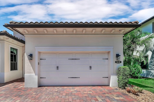 9219 Grand Prix Ln, Boynton Beach, FL 33472 - garage featuring driveway