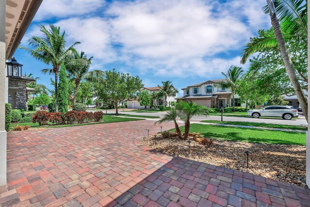 9219 Grand Prix Ln, Boynton Beach, FL 33472 - view of patio / terrace featuring curved driveway