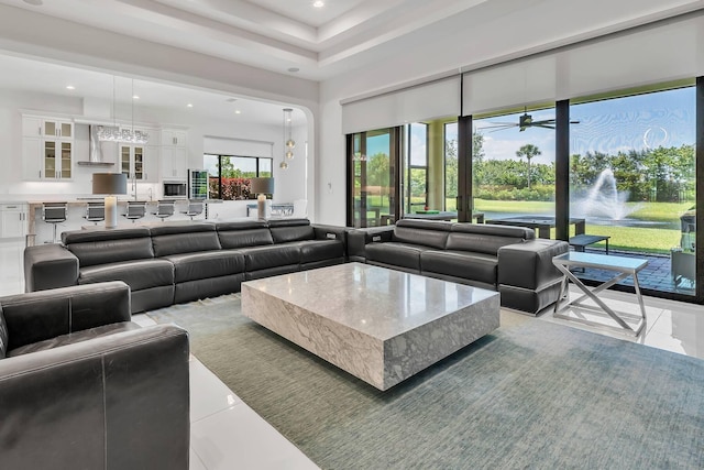 9219 Grand Prix Ln, Boynton Beach, FL 33472 - living room featuring recessed lighting, light tile patterned flooring, ceiling fan, and a towering ceiling