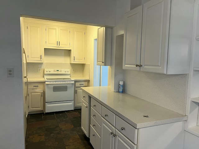 132 E Central Blvd, Lantana, FL 33462 - kitchen with white electric range oven, stone finish flooring, light countertops, and white cabinets