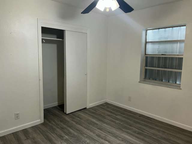 132 E Central Blvd, Lantana, FL 33462 - unfurnished bedroom featuring dark wood-type flooring, baseboards, a closet, and a ceiling fan