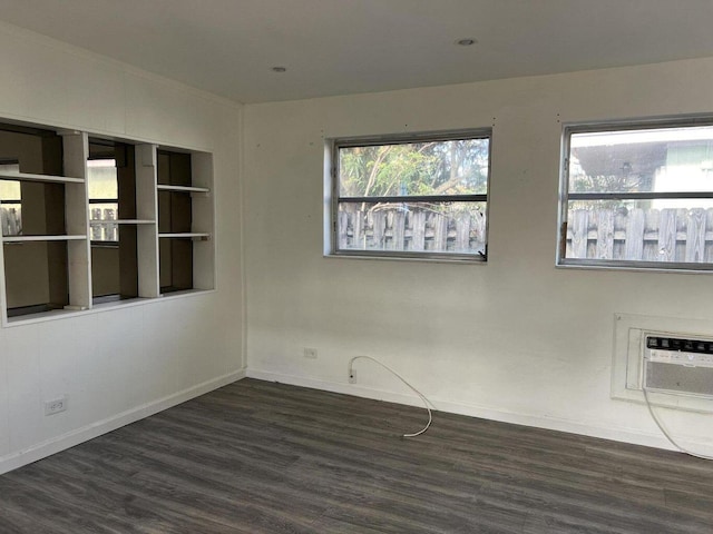 132 E Central Blvd, Lantana, FL 33462 - unfurnished room with wood finished floors, a wall mounted air conditioner, and baseboards
