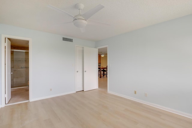 4411 Trevi Ct Unit 303, Lake Worth, FL 33467 - unfurnished bedroom featuring light wood finished floors, baseboards, a closet, and ensuite bath