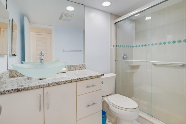 4411 Trevi Ct Unit 303, Lake Worth, FL 33467 - bathroom with toilet, a stall shower, vanity, and recessed lighting