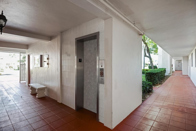 4411 Trevi Ct Unit 303, Lake Worth, FL 33467 - hall with elevator
