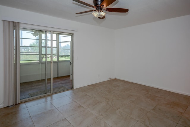 134 Southampton Unit B, West Palm Beach, FL 33417 - unfurnished room with a ceiling fan, light tile patterned flooring, and baseboards