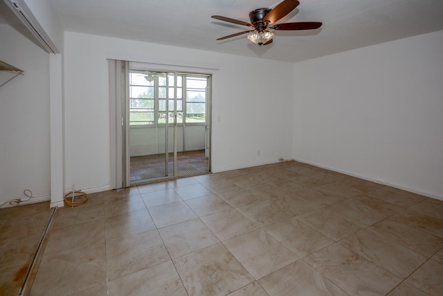 134 Southampton Unit B, West Palm Beach, FL 33417 - spare room with a ceiling fan and light tile patterned floors