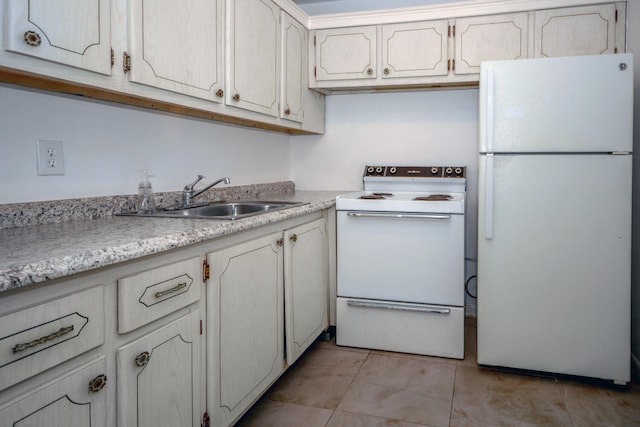 134 Southampton Unit B, West Palm Beach, FL 33417 - kitchen with white appliances, a sink, light countertops, and light tile patterned floors