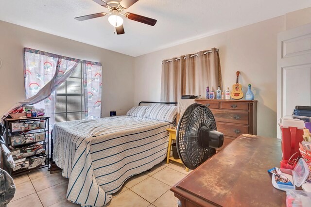 6528/6530 12th St W, Bradenton, FL 34207 - bedroom with light tile patterned flooring and a ceiling fan