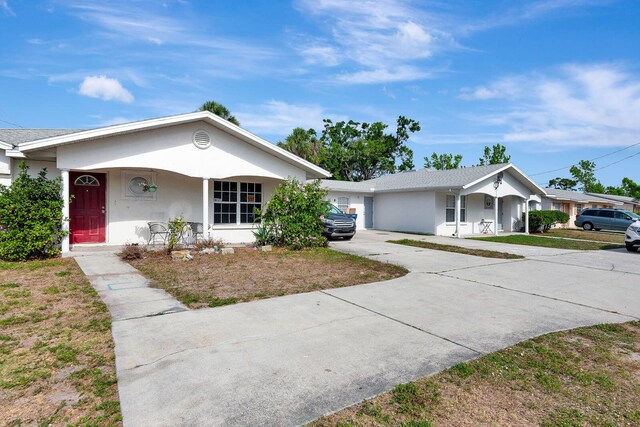 6528/6530 12th St W, Bradenton, FL 34207 - single story home with stucco siding, covered porch, and concrete driveway