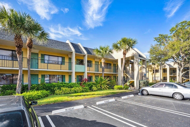 1618 Meadows Cir W, Boynton Beach, FL 33436 - view of building exterior featuring uncovered parking