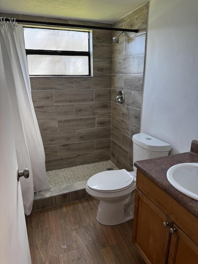 1618 Meadows Cir W, Boynton Beach, FL 33436 - bathroom with toilet, a stall shower, and wood finished floors