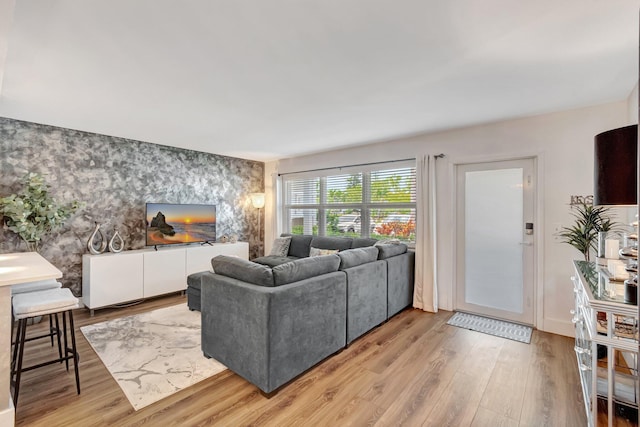 1044 Cambridge C Unit 1044, Deerfield Beach, FL 33442 - living area with an accent wall, wallpapered walls, light wood-style floors, and baseboards