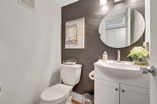 1044 Cambridge C Unit 1044, Deerfield Beach, FL 33442 - bathroom with toilet, vanity, and baseboards