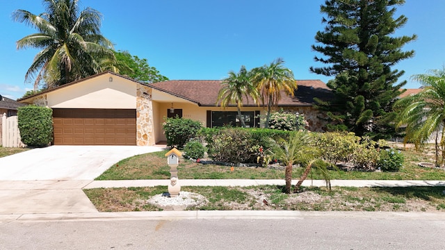 5701 Autumn Ridge Rd, Lake Worth, FL 33463 - single story home featuring an attached garage, concrete driveway, stucco siding, and stone siding