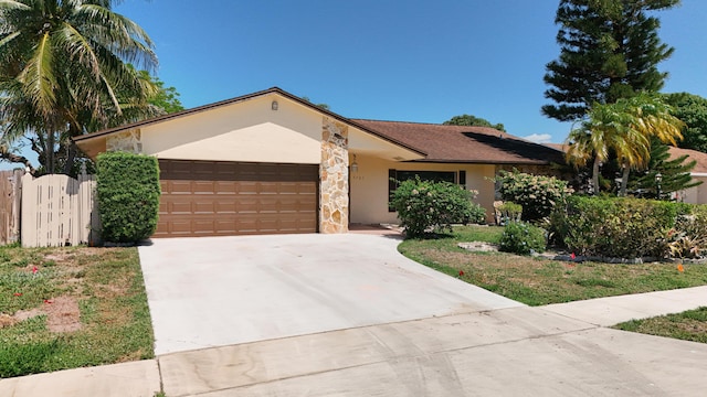 5701 Autumn Ridge Rd, Lake Worth, FL 33463 - ranch-style home featuring a garage, stucco siding, driveway, a gate, and fence