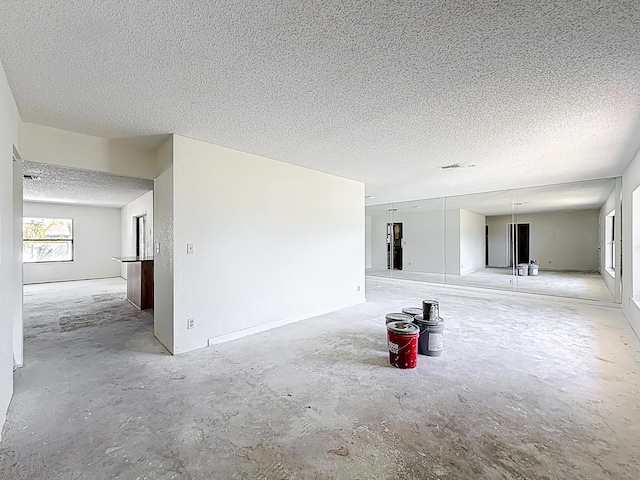 5701 Autumn Ridge Rd, Lake Worth, FL 33463 - spare room featuring a textured ceiling and concrete floors