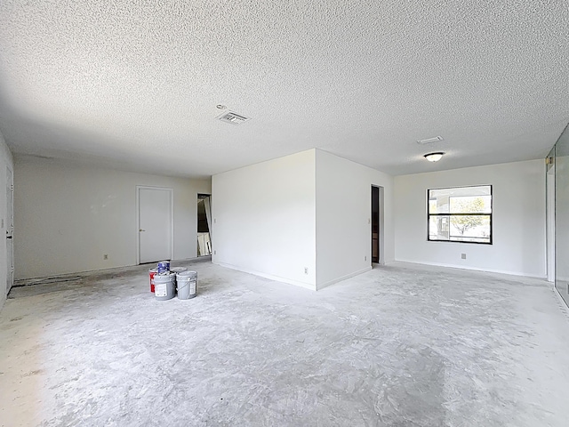 5701 Autumn Ridge Rd, Lake Worth, FL 33463 - empty room featuring concrete floors, a textured ceiling, and baseboards