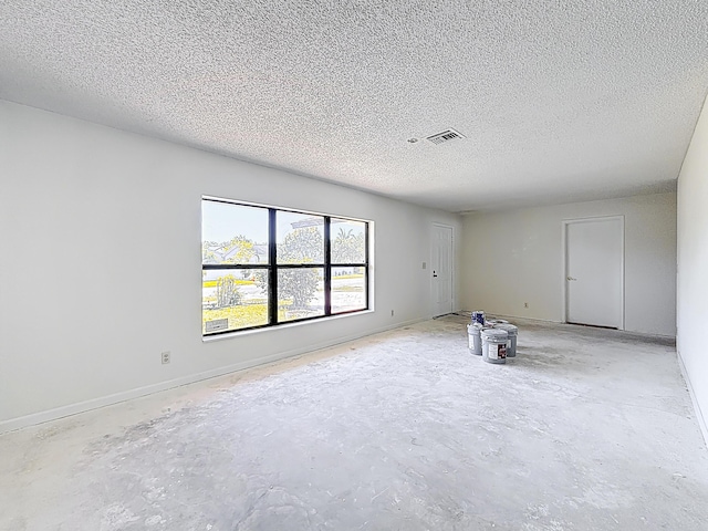5701 Autumn Ridge Rd, Lake Worth, FL 33463 - empty room with concrete floors and a textured ceiling