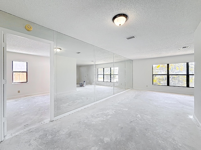 5701 Autumn Ridge Rd, Lake Worth, FL 33463 - empty room featuring a textured ceiling, baseboards, and a smoke detector