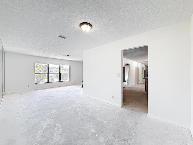 5701 Autumn Ridge Rd, Lake Worth, FL 33463 - spare room with a textured ceiling, concrete floors, and baseboards