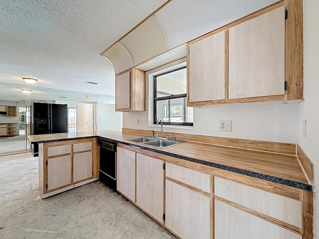 5701 Autumn Ridge Rd, Lake Worth, FL 33463 - kitchen featuring a sink, a peninsula, black appliances, a textured ceiling, and light brown cabinets