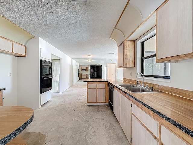 5701 Autumn Ridge Rd, Lake Worth, FL 33463 - kitchen featuring a sink, black appliances, concrete floors, a peninsula, and a textured ceiling